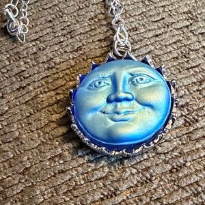 Blue and Silver Sun Face Pendant Necklace New 18 inch chain.
